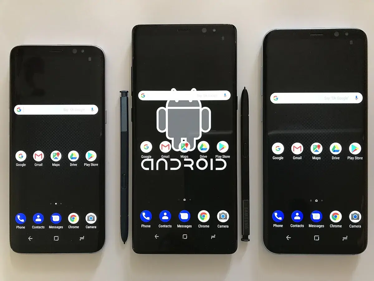 Three smartphones displaying Android home screens on a white background.