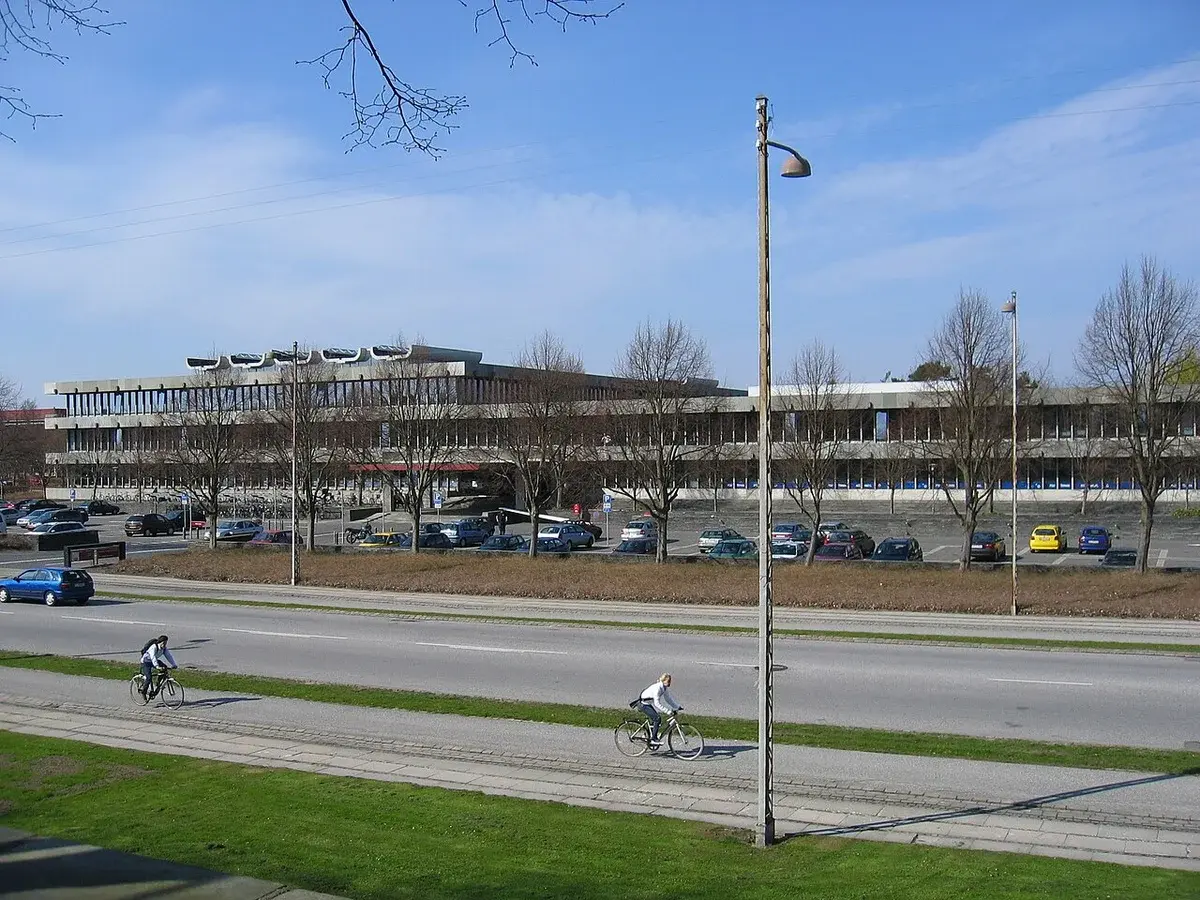 DTU campus building with cyclists in front
