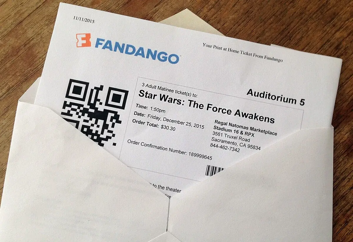 A printed Fandango ticket for Star Wars: The Force Awakens in an envelope.