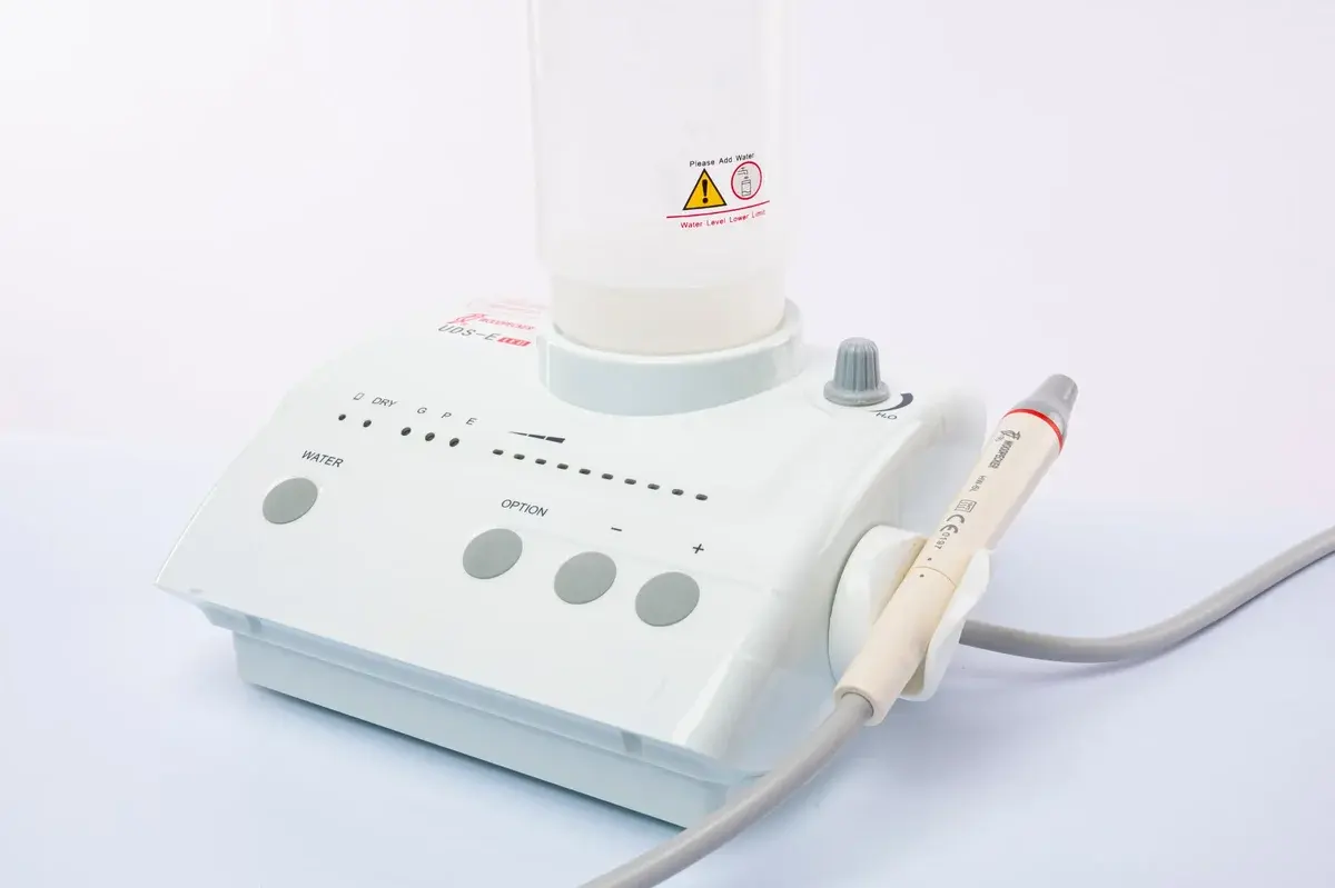 Dental ultrasonic scaler on a white background