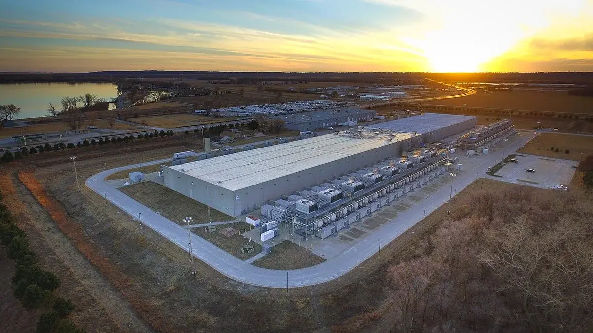 Aerial view of a Google data center complex at sunset.