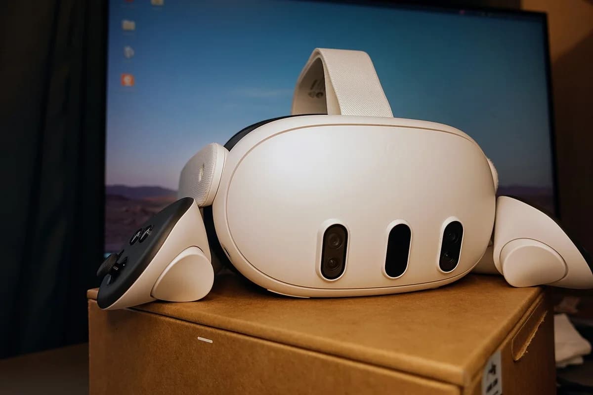 Meta Quest 3 headset shown from the front with controllers beside it.