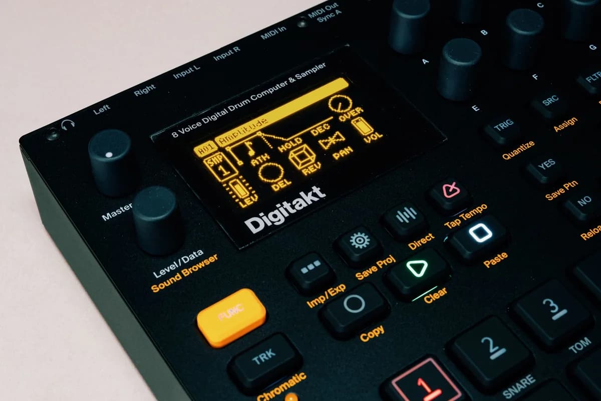 Close-up of a Digitakt drum machine and sampler control panel.