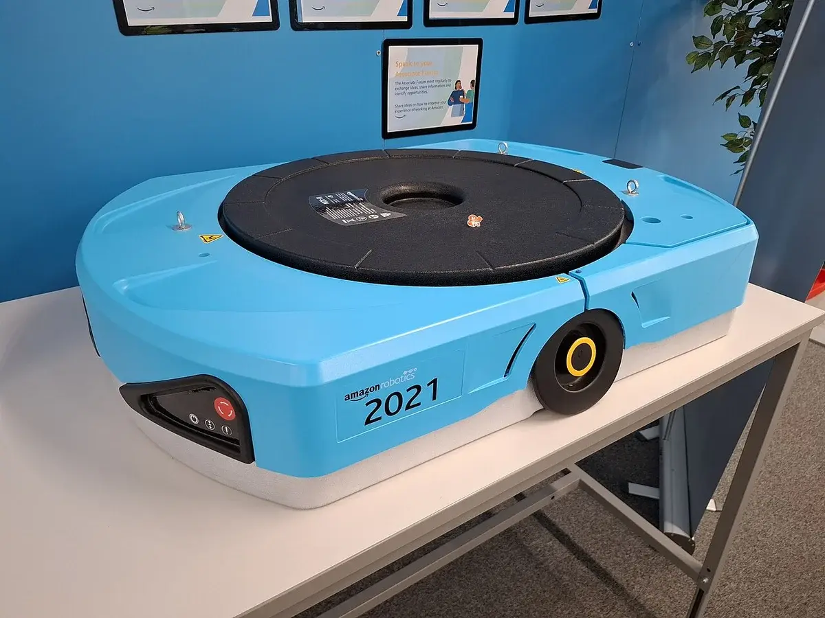 A blue Amazon Robotics drive-unit robot displayed indoors.